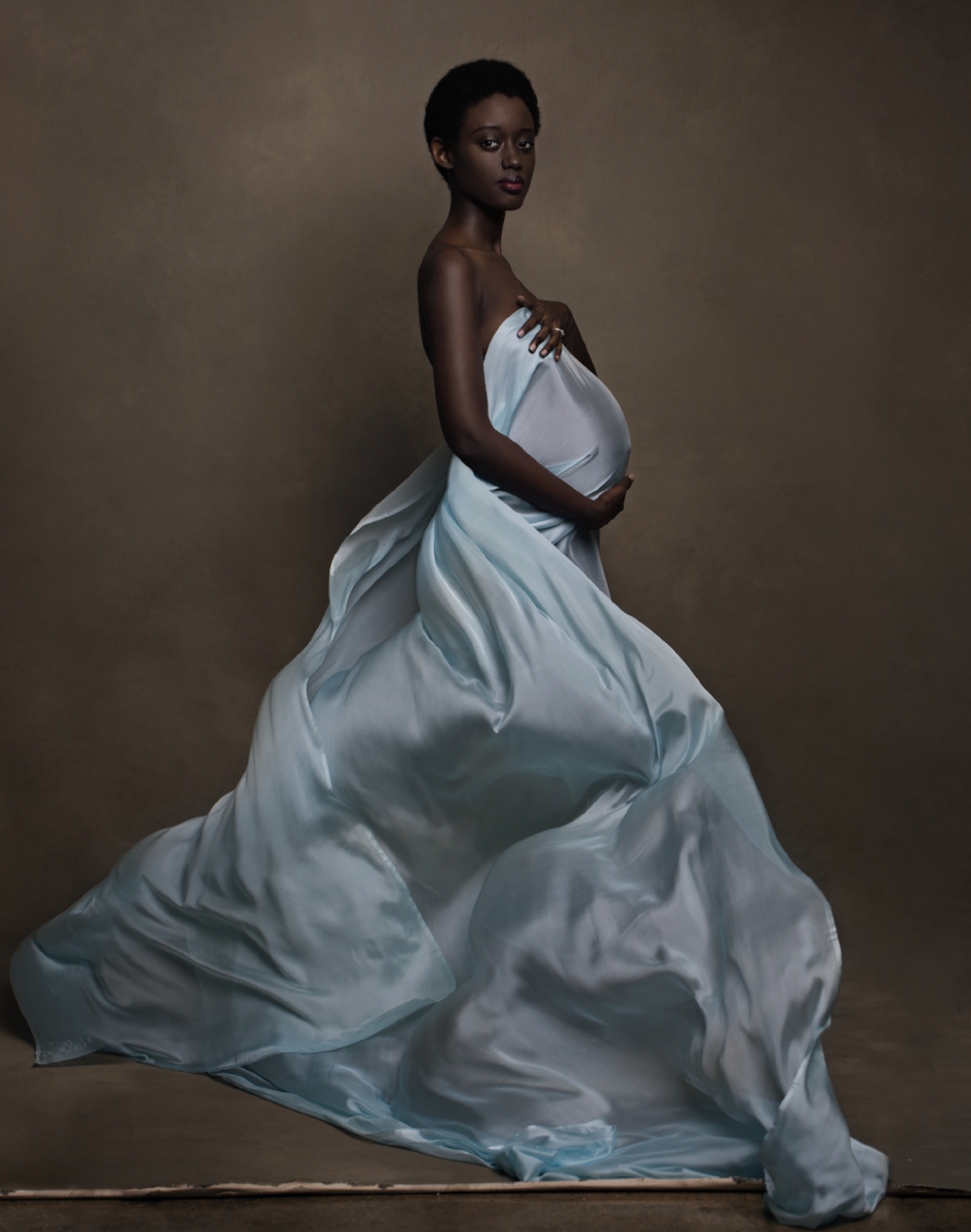 Beautiful flowing silk fabrics maternity portrait or proud and stunning African woman